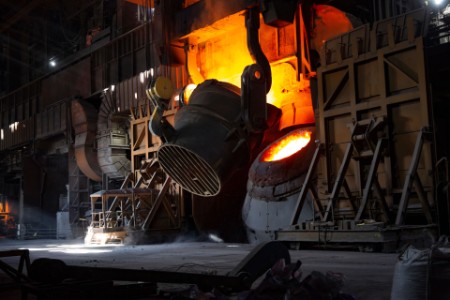 A bucket tilts over a furnace mouth at bsl scunthorpe plant