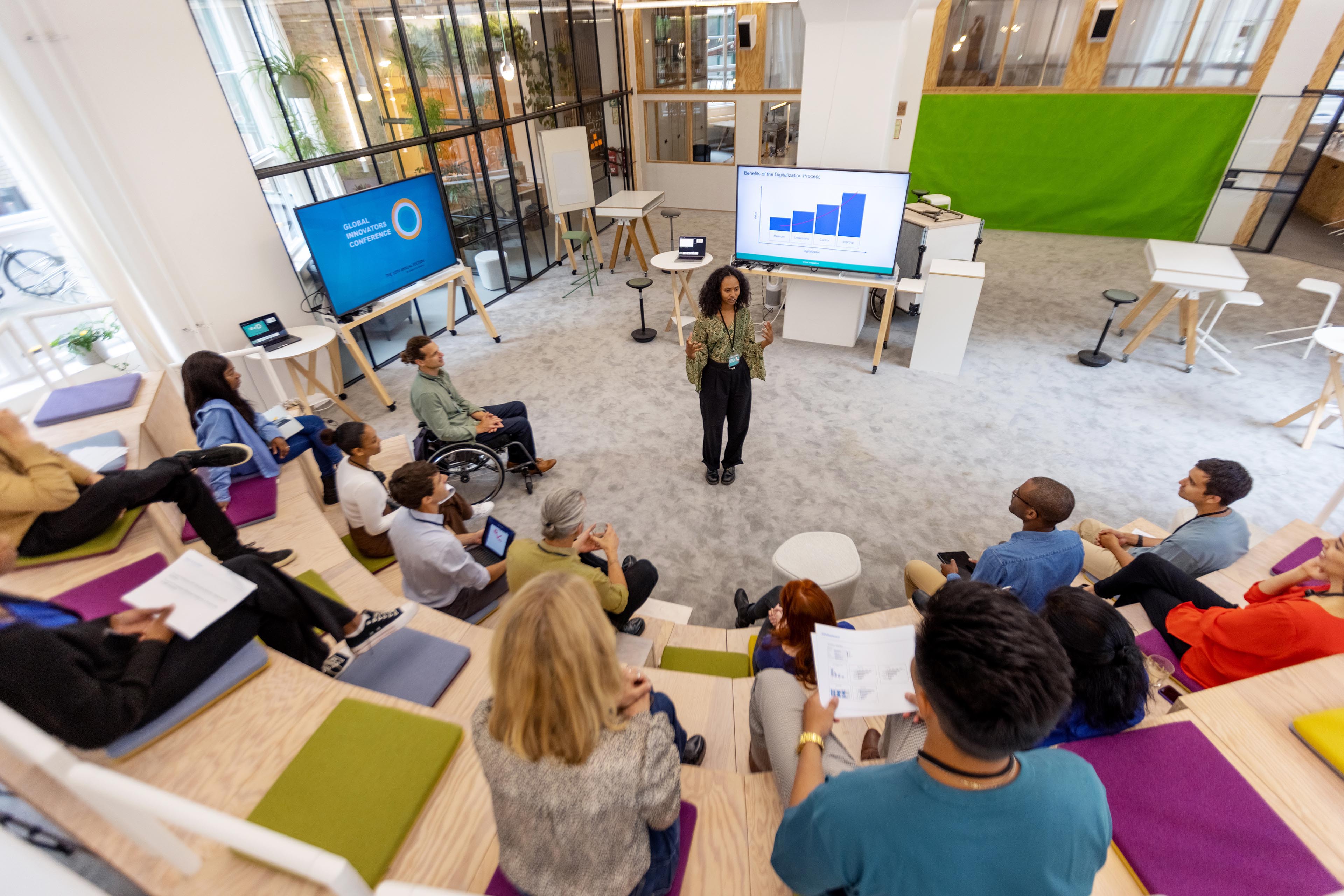 African woman addressing audience at startup launch event African woman addressing audience at startup launch event