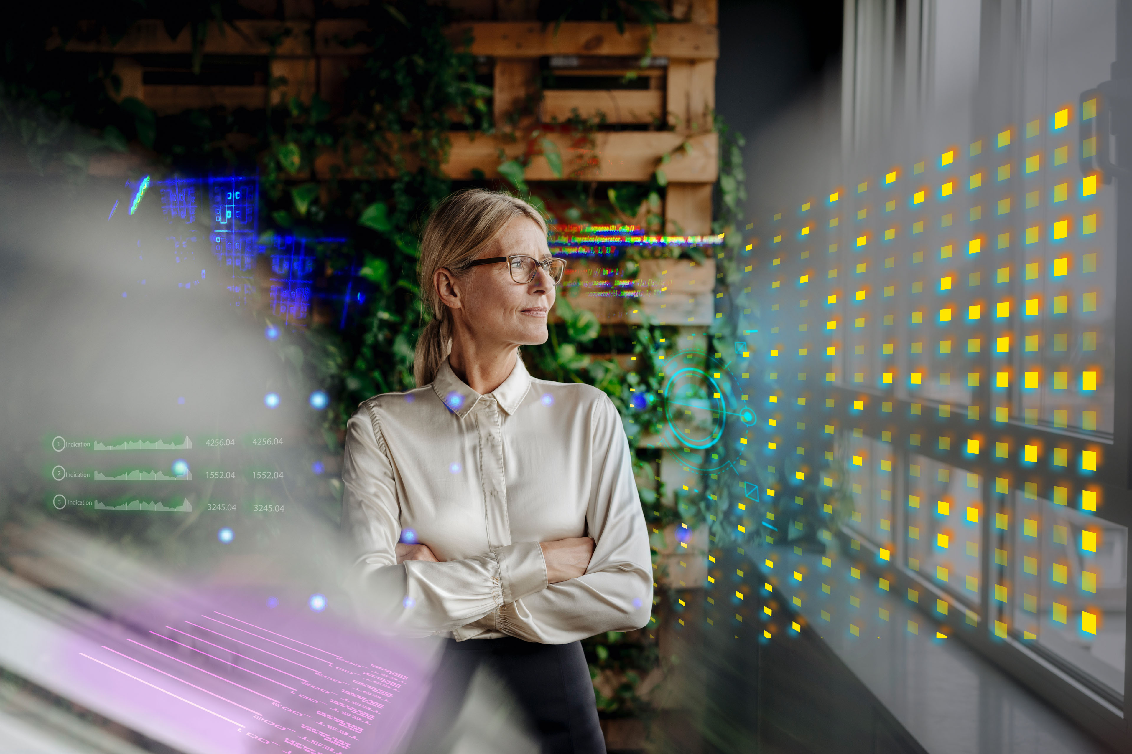 Businesswoman in green office looking out of window Businesswoman in green office looking out of window