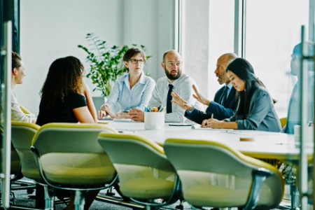 Businessman leading meeting in conference room