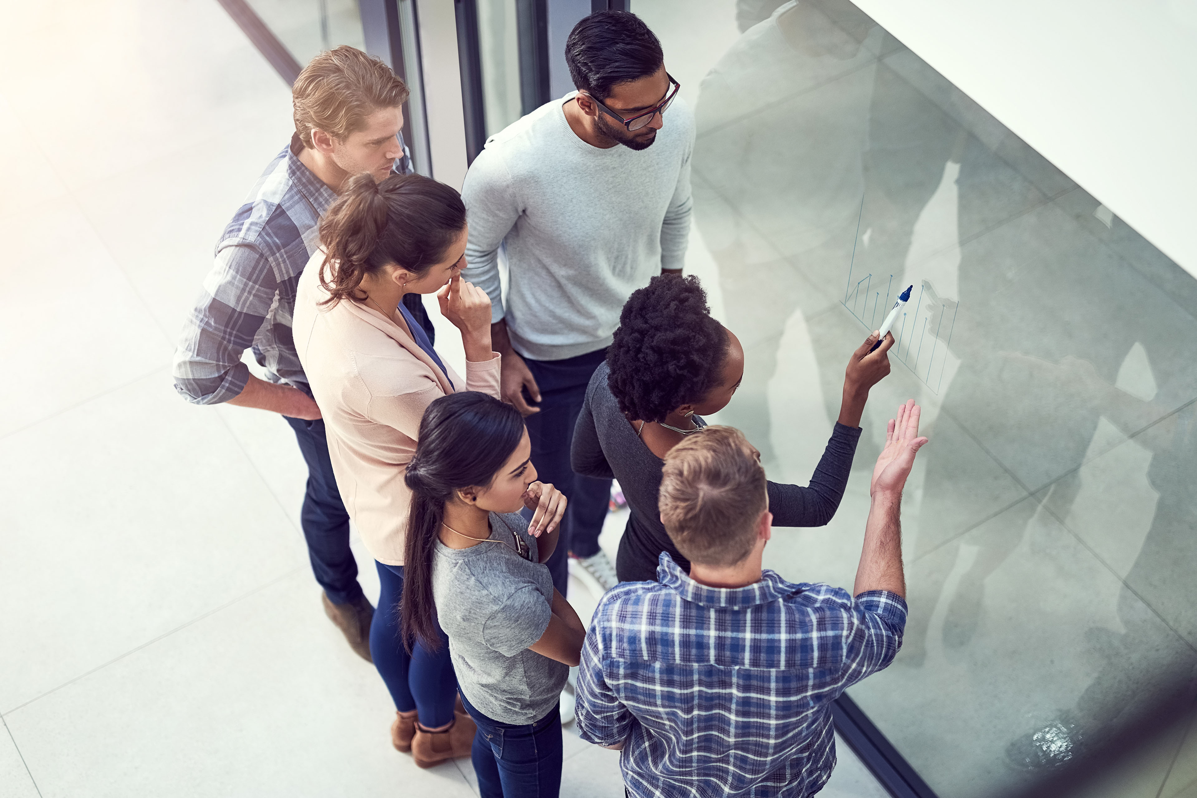 High angle group people planning in office Headlights bridge frozen river