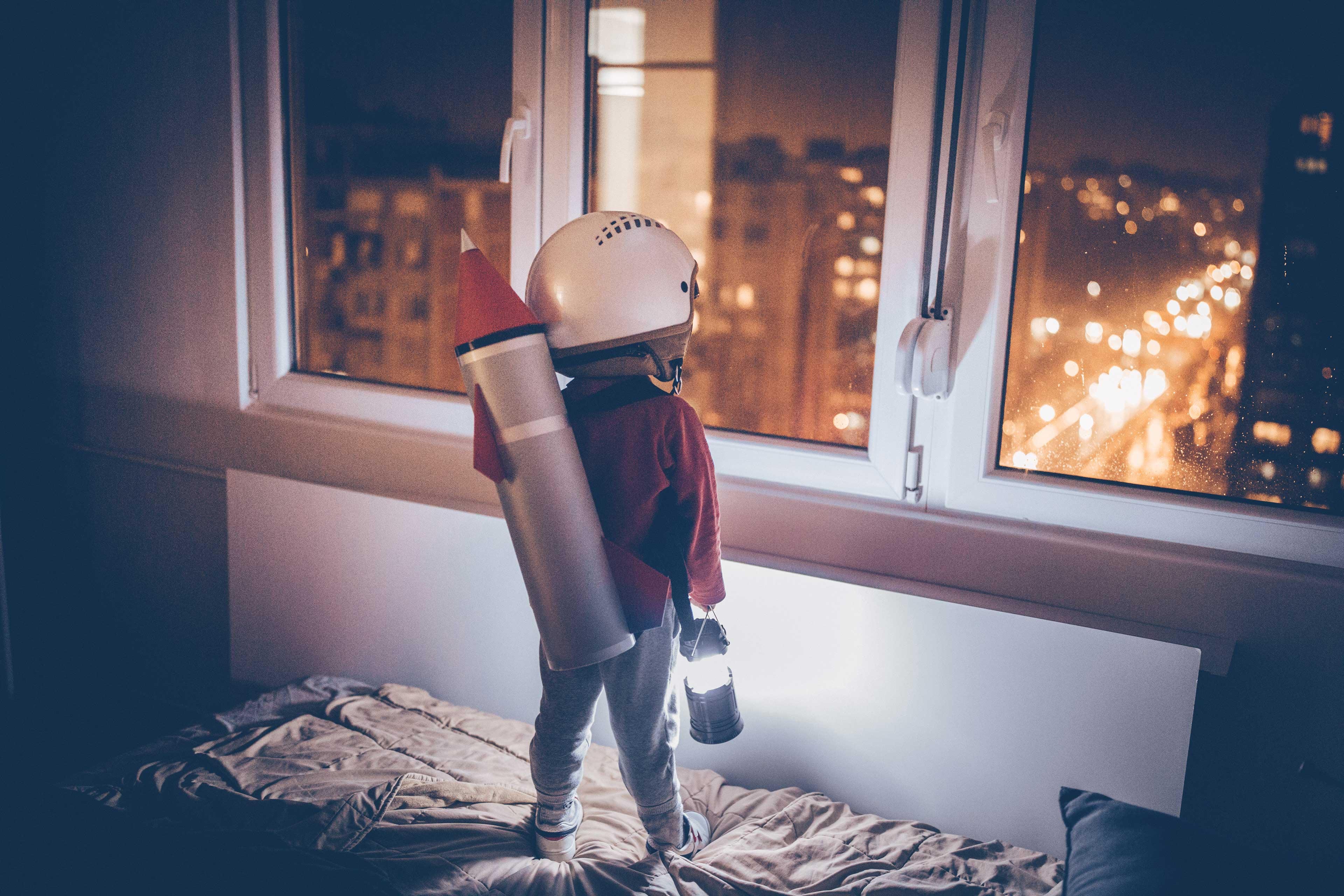A kid with a toy rocket