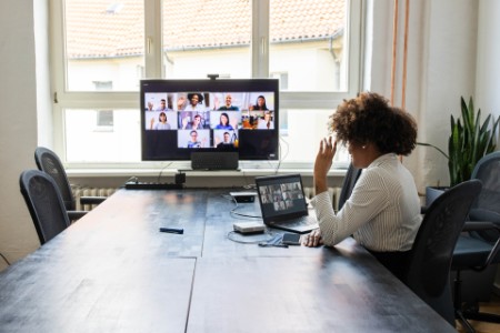 Meeting over a video call in office post pandemic