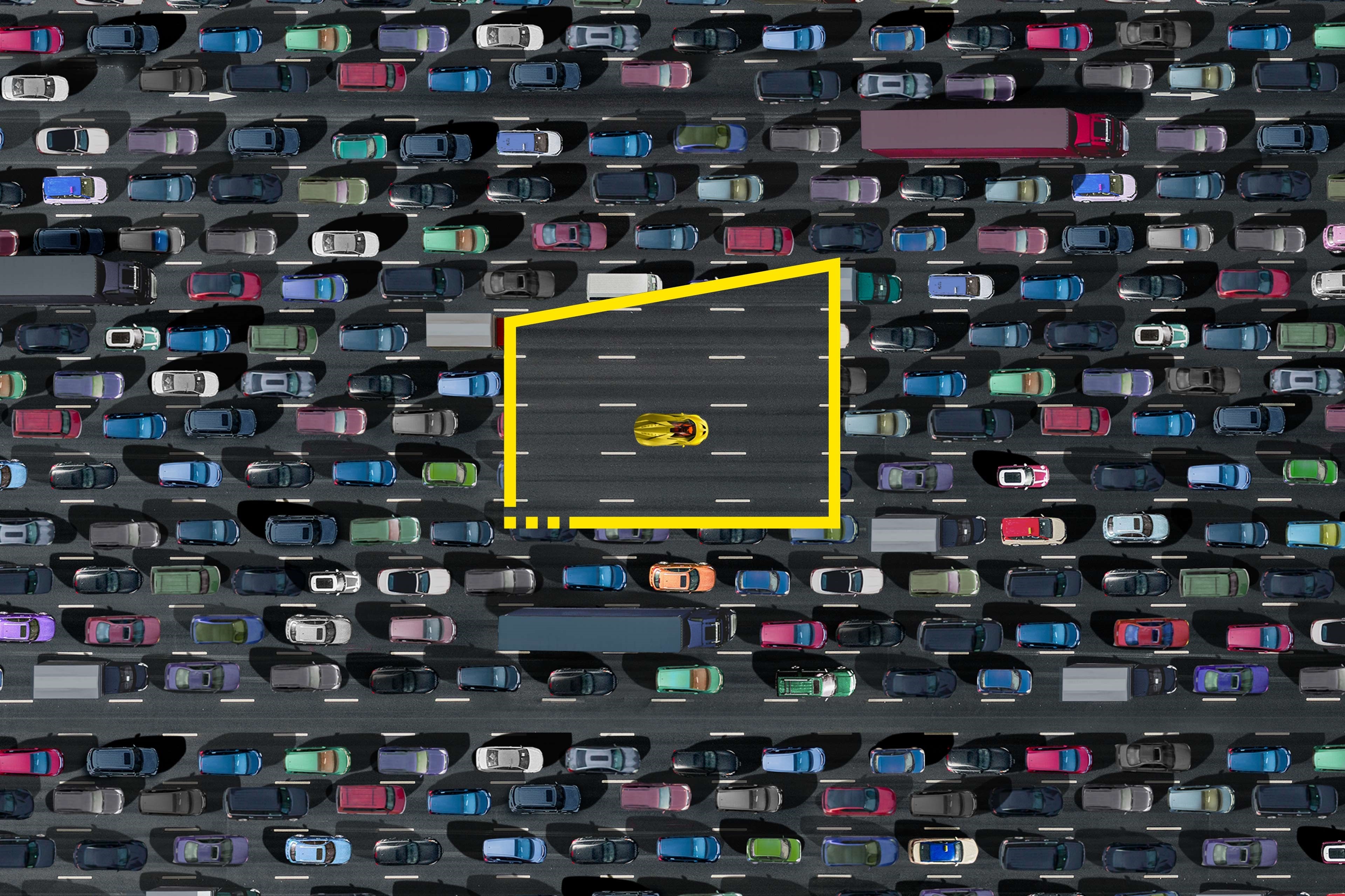 Race car in yellow frame in middle of traffic