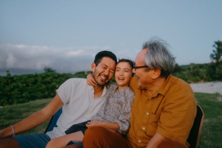 Three generation family having a good time at dusk