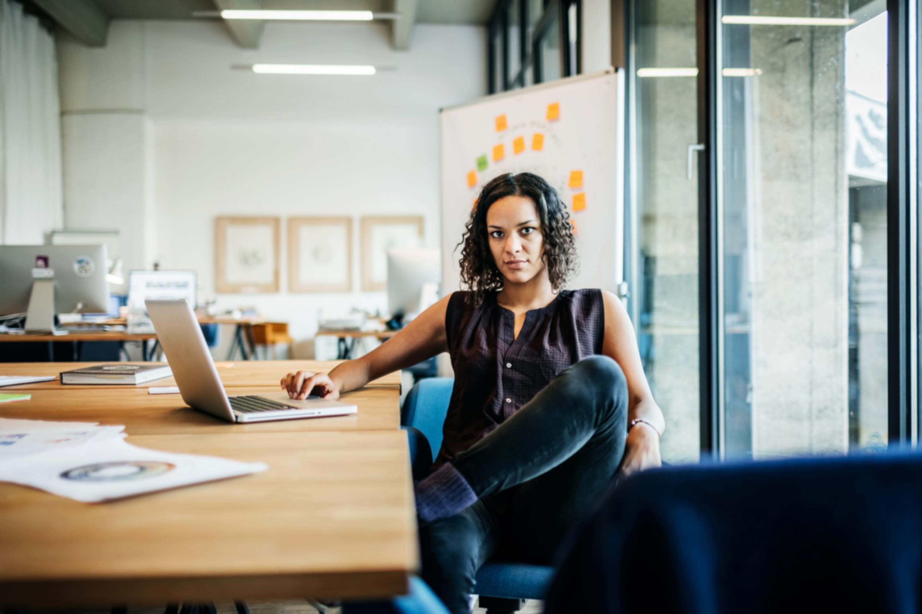 Woman with computer at work desk